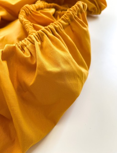 Prześcieradło-bawełniane-z-gumką-do-wózka-gondoli-80x40-żółte-mango-materiał